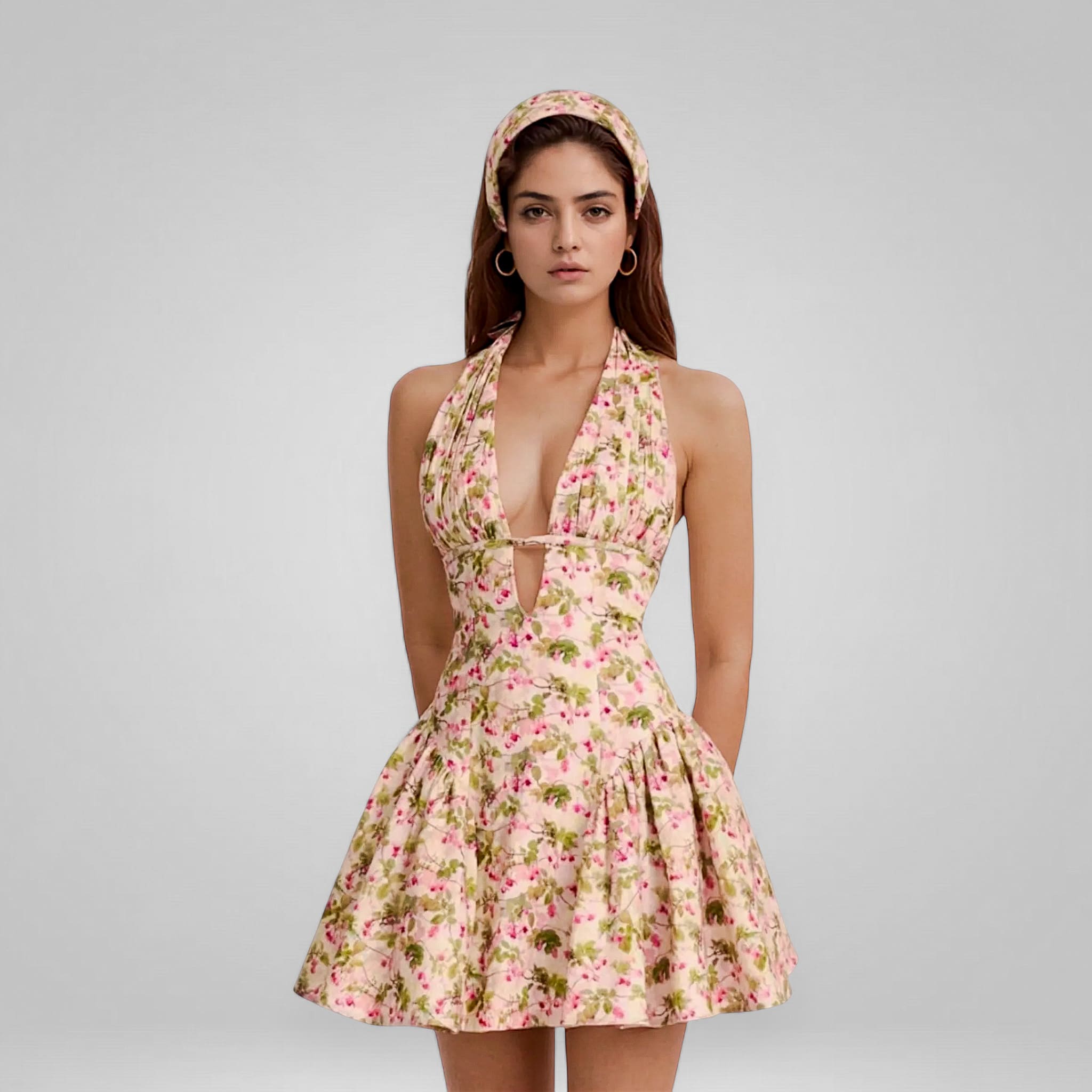 Woman wearing a floral dress with a plain background