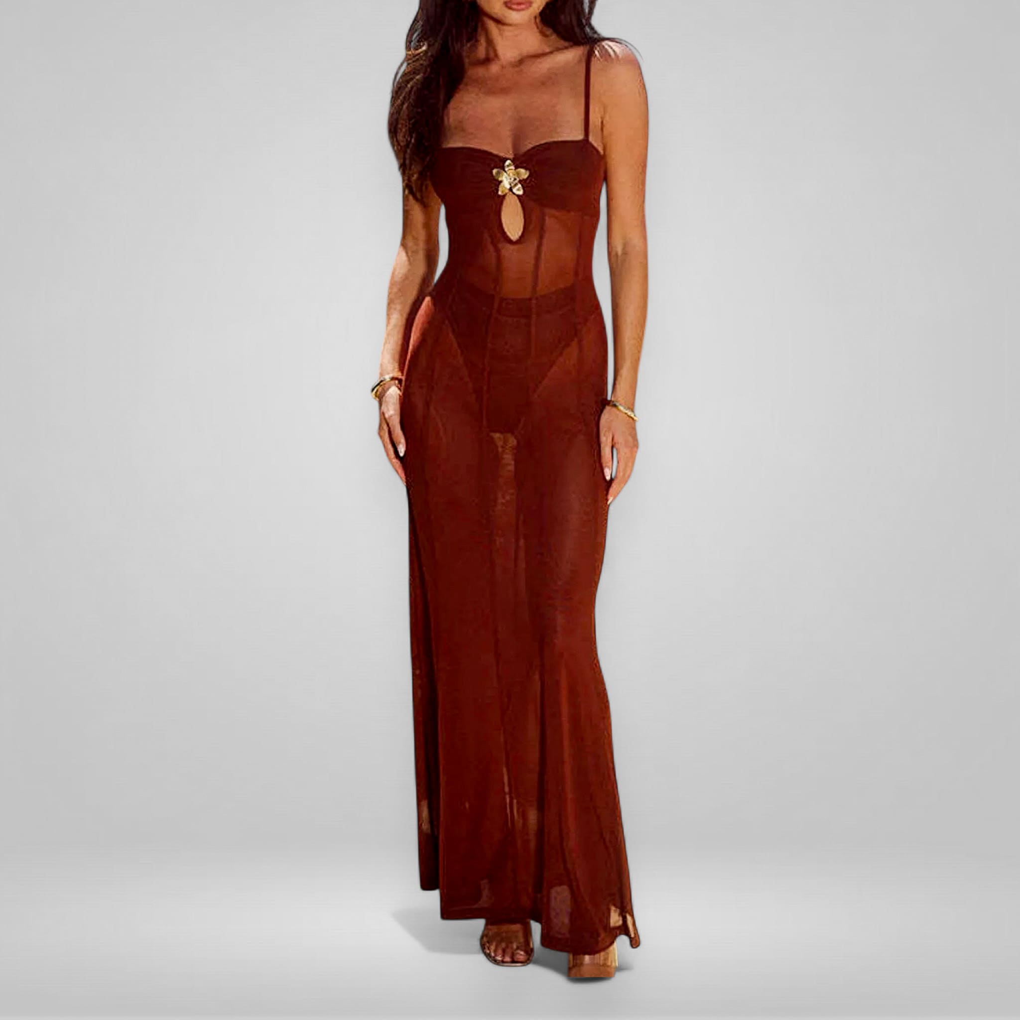 Brown sheer dress with floral embellishment on a gray background