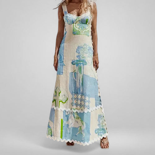 Woman wearing a long, patterned dress with a neutral background